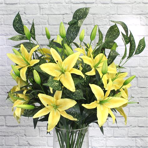 Artificial Yellow Lily flower arrangement in a Work Studio