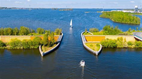 Premium Photo | Aquaduct veluwemeer nederland aerial view from the drone a sailboat sails ...