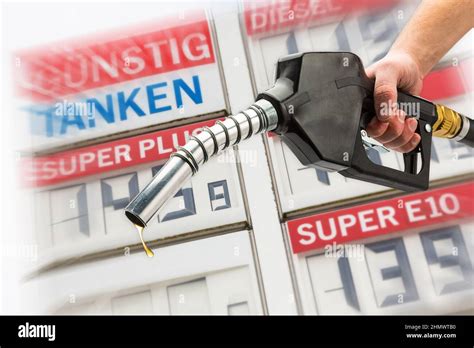 pump nozzle for fuel gas on gas station with price Stock Photo - Alamy