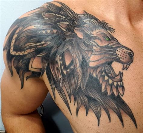 Lion tattoo Lion tribal tattoo Chest and shoulder tattoo | Tattoo chest and shoulder, Shoulder ...