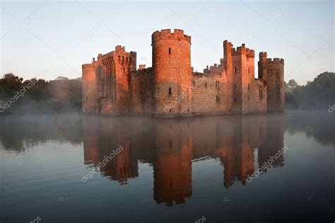 Stunning moat and castle in Autumn Fall sunrise with mist over m Stock Photo by ©Veneratio 17854879