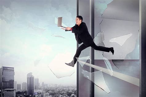 Royalty Free Businessman Escaping Or Jumping Out Of An Office Window Pictures, Images and Stock ...