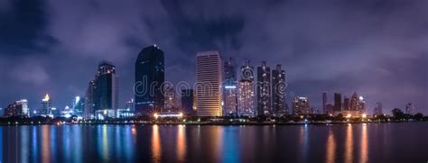 Big City in the Night Life with Reflection of Water Wave. Long Exposure ...