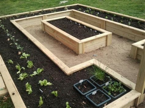 Raised bed garden. This is so practical yet very pretty to look at ...