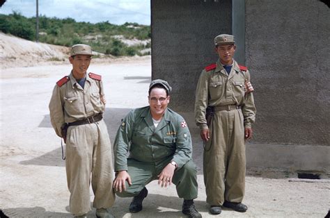 An American soldier poses with two North Korean soldiers at the Joint ...