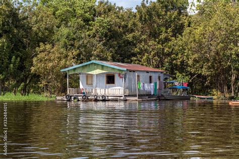 floating house in the amazon river Stock Photo | Adobe Stock