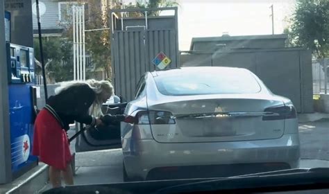 Video Of A Lady Trying To Refill Her 'Electric' Tesla With Petrol Is Leaving People In Splits