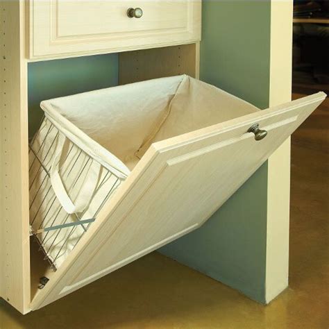 The Tilt-Out Laundry Hamper is a wire basket designed to mount to the ...