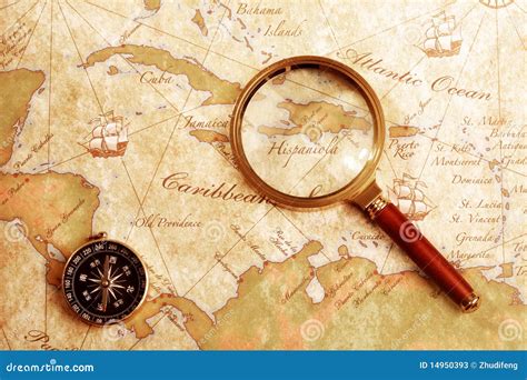 Old Brass Compass On A Treasure Map Stock Image - Image: 14950393