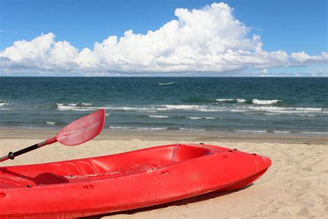 Kayaks on the sandy beach for tourism. 6697411 Stock Photo at Vecteezy