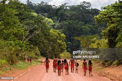 Brazilian Waiapi walk on the road of the Waiapi indigenous reserve,... News Photo - Getty Images