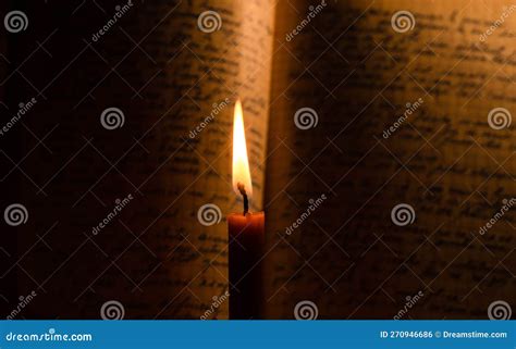 Open Bible Illuminated by a Single Candle Stock Photo - Image of shine, book: 270946686