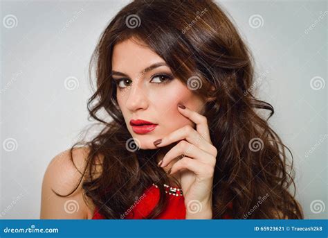 Woman with Beauty Long Brown Hair and Red Lips in Red Dress Stock Image ...