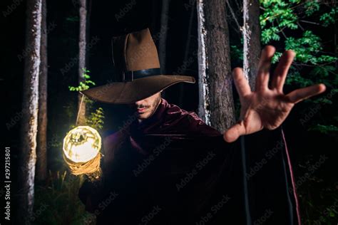 Cosplayer in a wizard costume in the forest Stock Photo | Adobe Stock