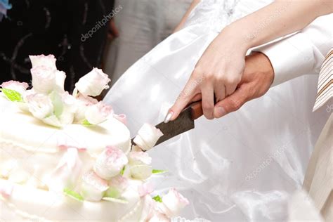 Cutting a wedding cake — Stock Photo © vsurkov #28678435