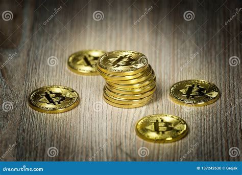 Bitcoin Gold Coins on a Wooden Table Stock Photo - Image of golden, currency: 137242630