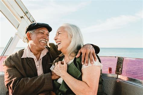 Cheerful senior couple enjoying Ferris | Premium Photo - rawpixel