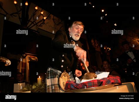 Addressing the haggis at a traditional Burns Night Supper Stock Photo ...