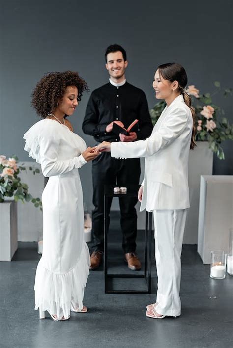 Women Holding Hands at Wedding Ceremony · Free Stock Photo