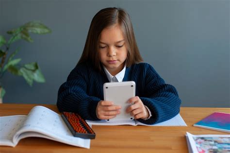 Free Photo | Medium shot girl learning math at school