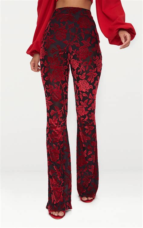 Red Velvet Flock Flare Leg Pants | PrettyLittleThing UAE