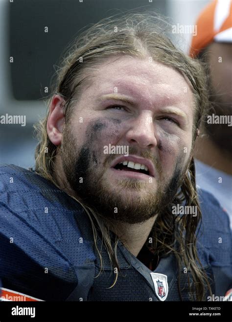 Chicago Bears defensive tackle Dusty Dvoracek watches the action from the sideline as the Bears ...