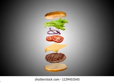 Deliciosa hamburguesa con ingredientes flotantes en Foto de stock 533743870 | Shutterstock