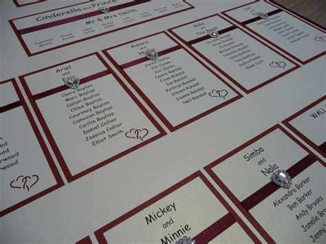 wedding seating cards are laid out on the table