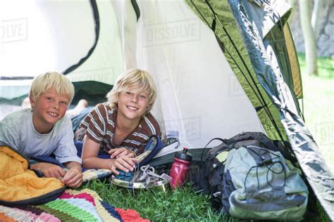 Boys camping in tent - Stock Photo - Dissolve