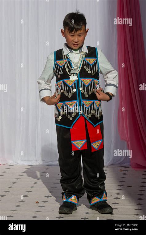 Boys model modernized Hmong outfits at a fashion show during the Hmong ...