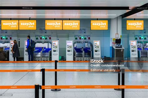 People Using Easyjet Selfservice Checkin Terminals In The Airport Stock ...