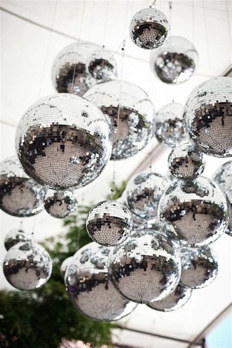 Love this hanging disco balls installation for a wedding dance floor. # ...