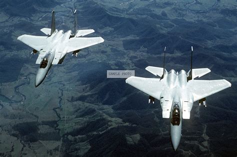 Amazon.com: Photo A front view of two F-15 Eagle aircraft carrying AIM-9 Sidewinder missiles ...