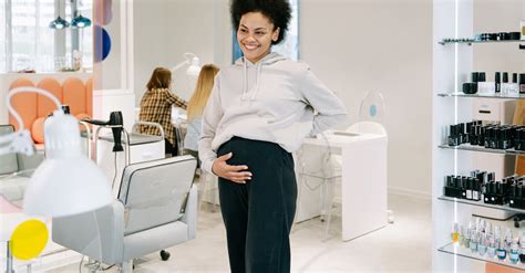 Pregnant Woman Standing Inside a Salon · Free Stock Photo