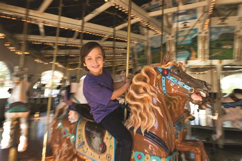 Boy on Carousel at Seaport Village - San Diego Travel Blog