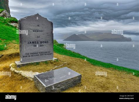 Kallur Lighthouse and James Bond memorial stone on Kalsoy, Faroe Islands Stock Photo - Alamy