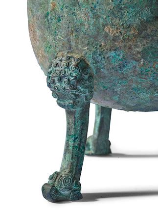 Bonhams : A PAIR OF ARCHAIC BRONZE RITUAL VESSELS AND COVERS, DUN ...