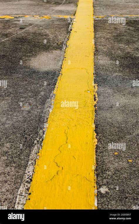 The yellow line in the parking lot above a building Stock Photo - Alamy