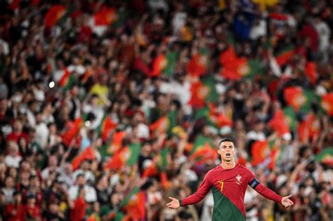 Cristiano Ronaldo lifted by fan who ran onto field during Portugal win