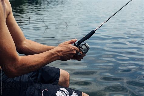 "Man Holding A Fishing Pole" by Stocksy Contributor "Gabi Bucataru ...