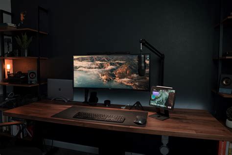 Stunning widescreen monitor setup with perfect lighting - Minimal Desk Setups