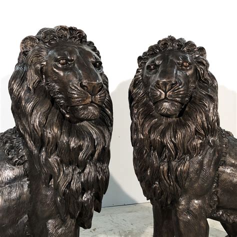 Bronze Large Sitting Lion Sculpture Pair - Metropolitan Galleries Inc.