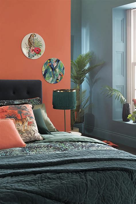 Tropical teal bedroom with contrasting orange and teal walls, and a dark velvet bed. | Teal ...