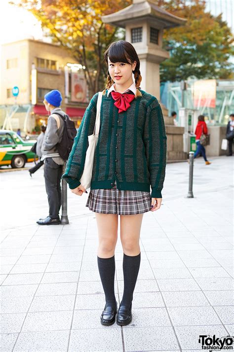 Harajuku Girl in Plaid Skirt, Green Cardigan, Loafers & Red Bow