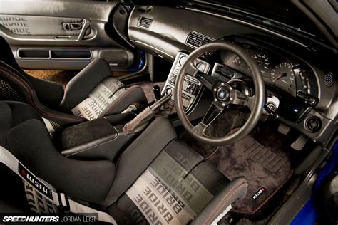 the interior of a sports car with black leather seats and steering ...