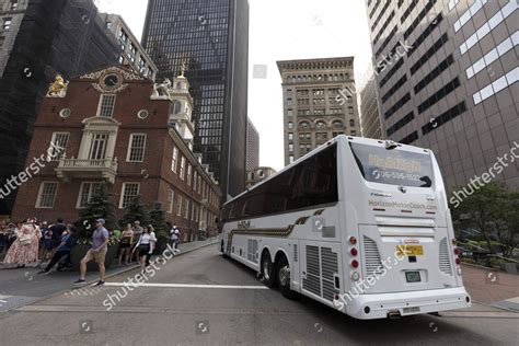 Orange Line Shuttle Bus Turns Onto Editorial Stock Photo - Stock Image ...