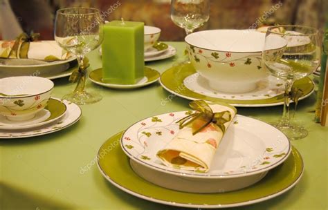 An elegant dining setting with green tableware Stock Photo by ©chagall 26958769
