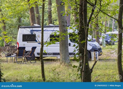 Campsite with camper bus stock photo. Image of mobile - 296955022