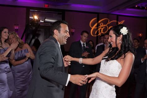 a bride and groom are dancing together at their wedding reception in ...