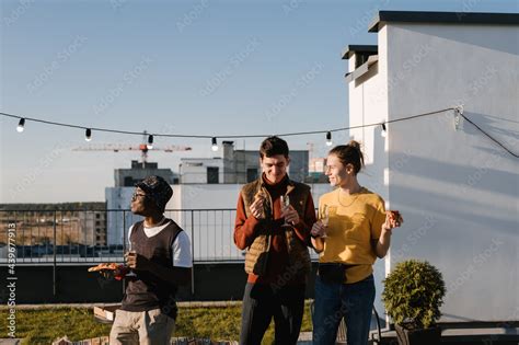 Male friends chilling together on terrace Stock Photo | Adobe Stock